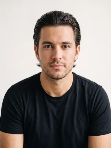 The same man with mid length slicked back hair